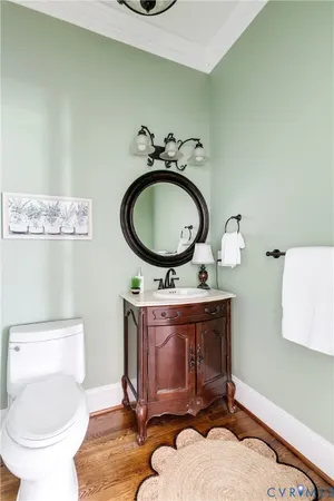 a bathroom with a granite countertop sink a mirror and shower