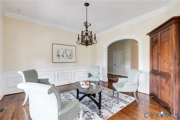 a view of a dining room with furniture and wooden floor