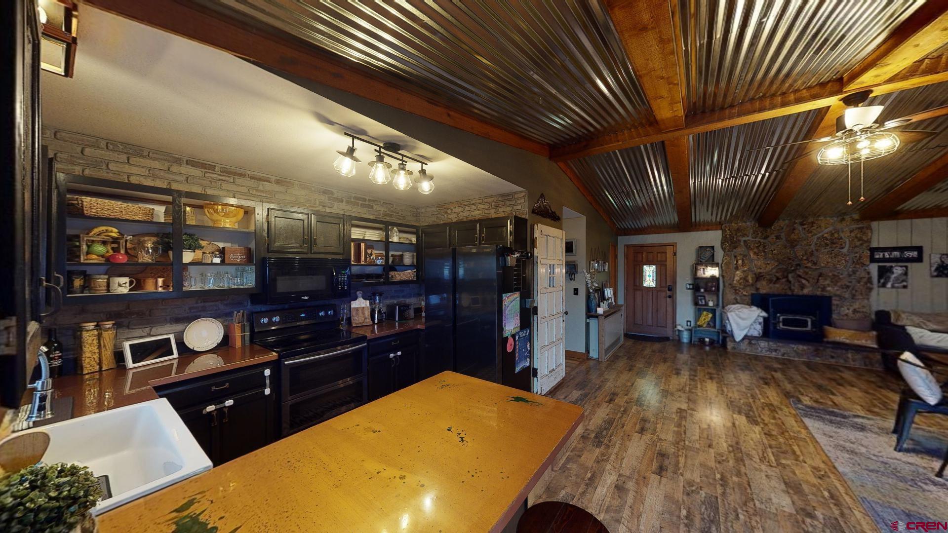 18377 Highway 65 Cedaredge, CO 81413 - Photo 15 of 35 a living room with lots of furniture