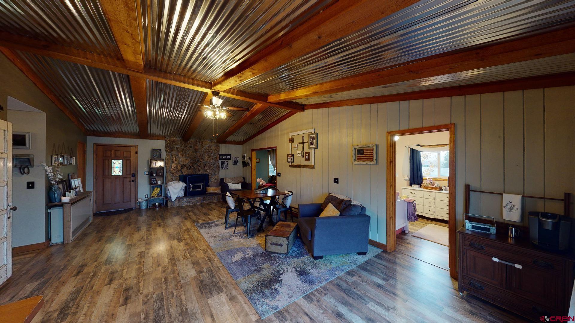 18377 Highway 65 Cedaredge, CO 81413 - Photo 16 of 35 a living room with furniture and wooden floors