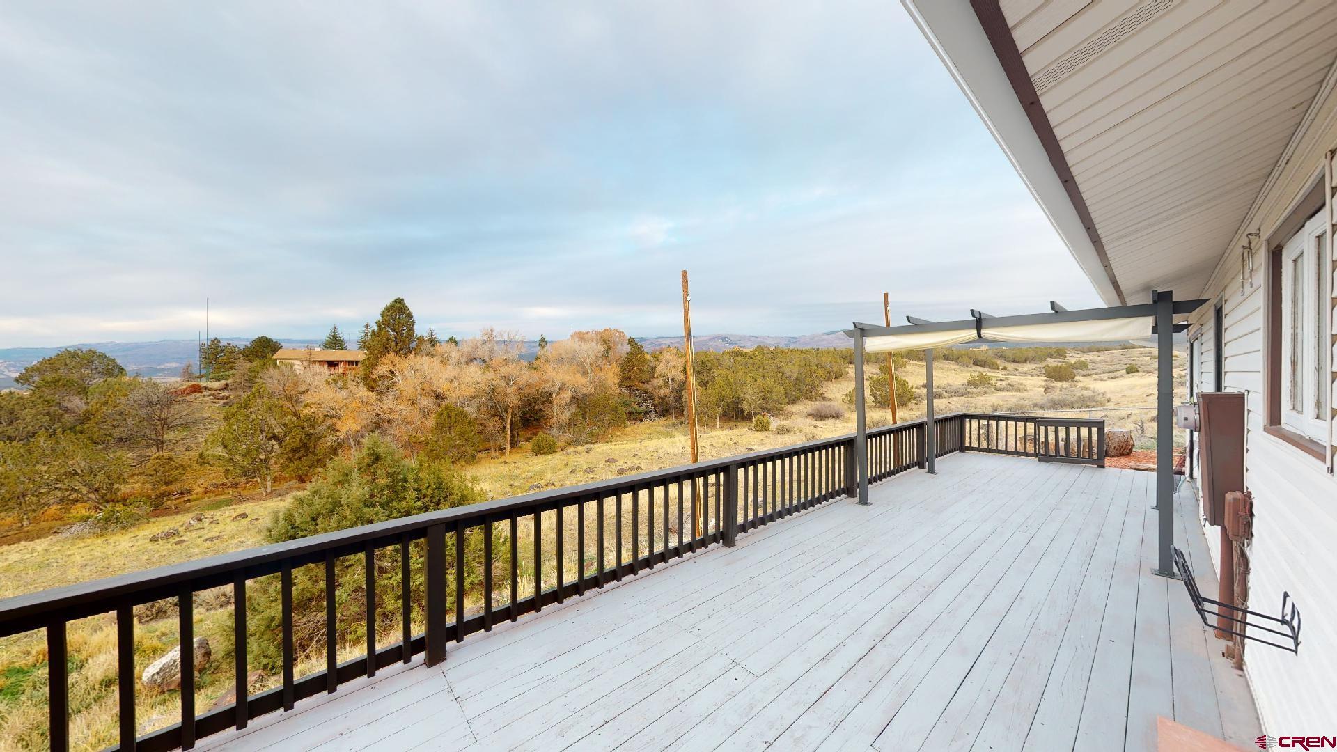 18377 Highway 65 Cedaredge, CO 81413 - Photo 22 of 35 a view of ocean from a balcony