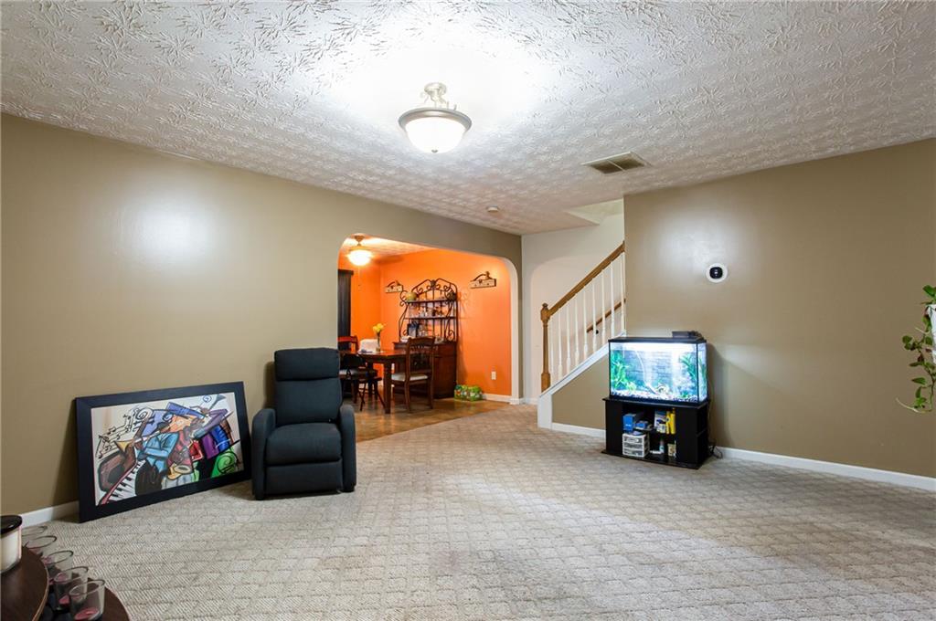 690 Georgetown Lane Jonesboro, GA 30236 - Photo 12 of 30 a living room with furniture and a flat screen tv