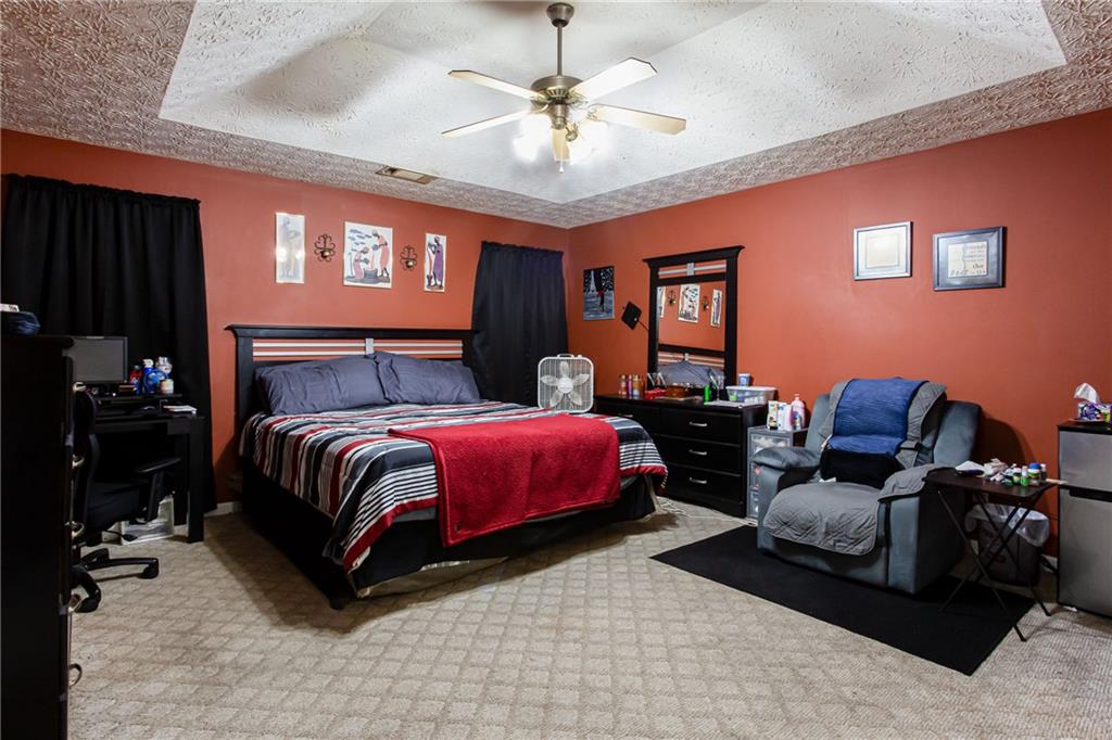 690 Georgetown Lane Jonesboro, GA 30236 - Photo 20 of 30 a bedroom with a bed and dresser