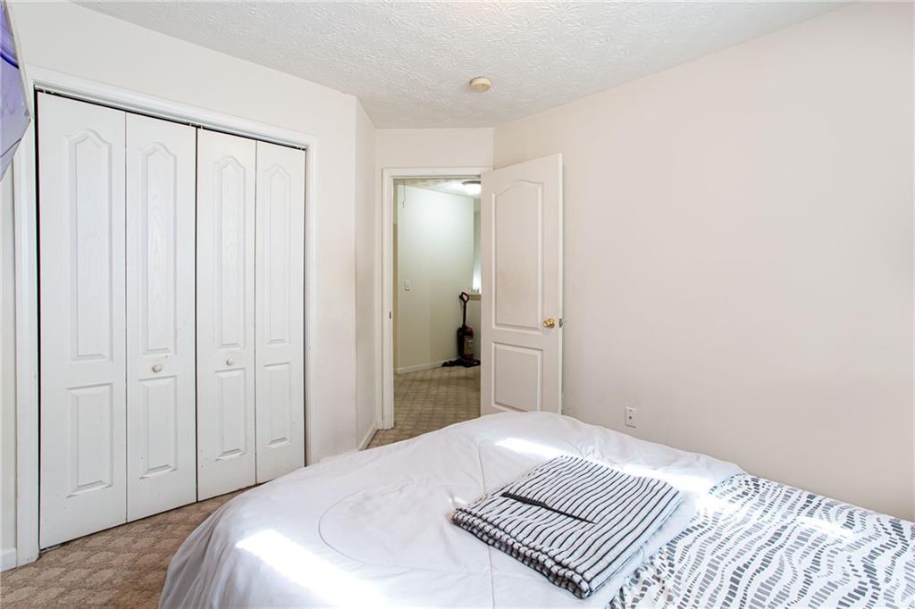 690 Georgetown Lane Jonesboro, GA 30236 - Photo 29 of 30 a bedroom with a bed and a shower