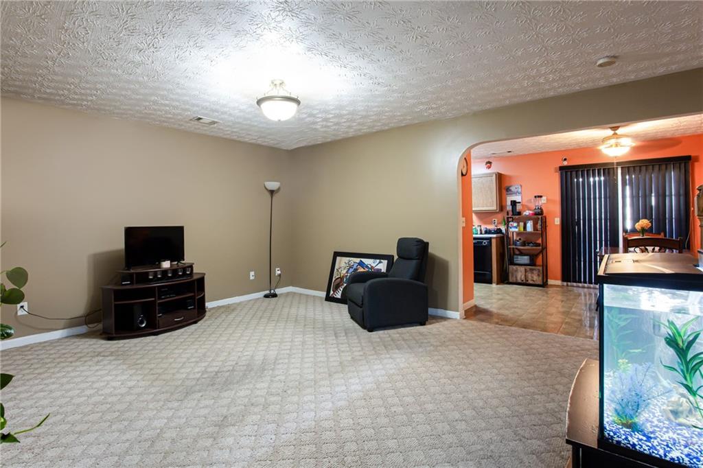 690 Georgetown Lane Jonesboro, GA 30236 - Photo 9 of 30 a living room with furniture and a flat screen tv