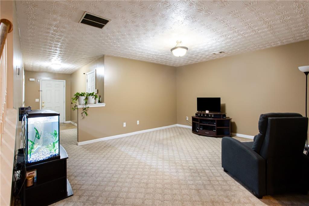 690 Georgetown Lane Jonesboro, GA 30236 - Photo 10 of 30 a view of a livingroom with furniture and a flat screen tv