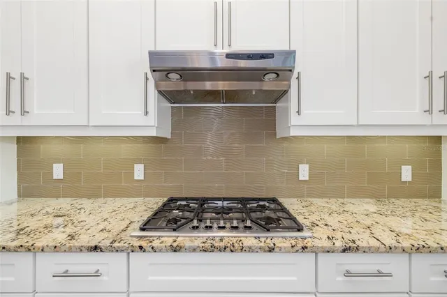 a spacious bathroom with a bathtub sink and mirror