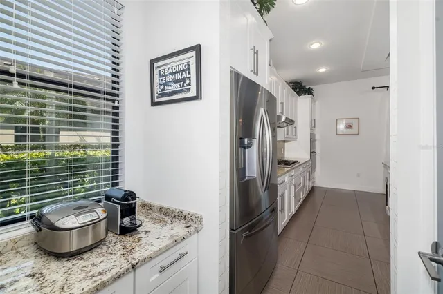 a bathroom with a double vanity sink and mirror