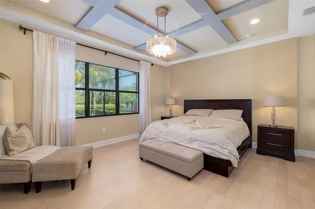 a bed room with two bed and a ceiling fan