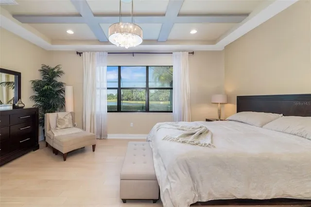 a bedroom with a bed and a lamp