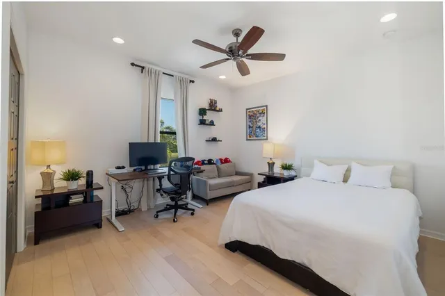 a view of a white house with a sink and a garden