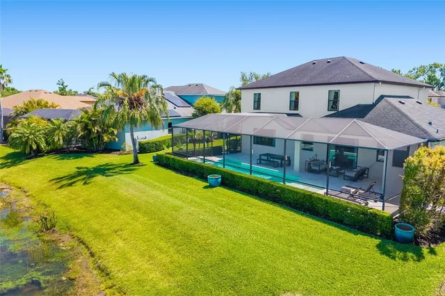 a dining room with furniture a rug and a chandelier