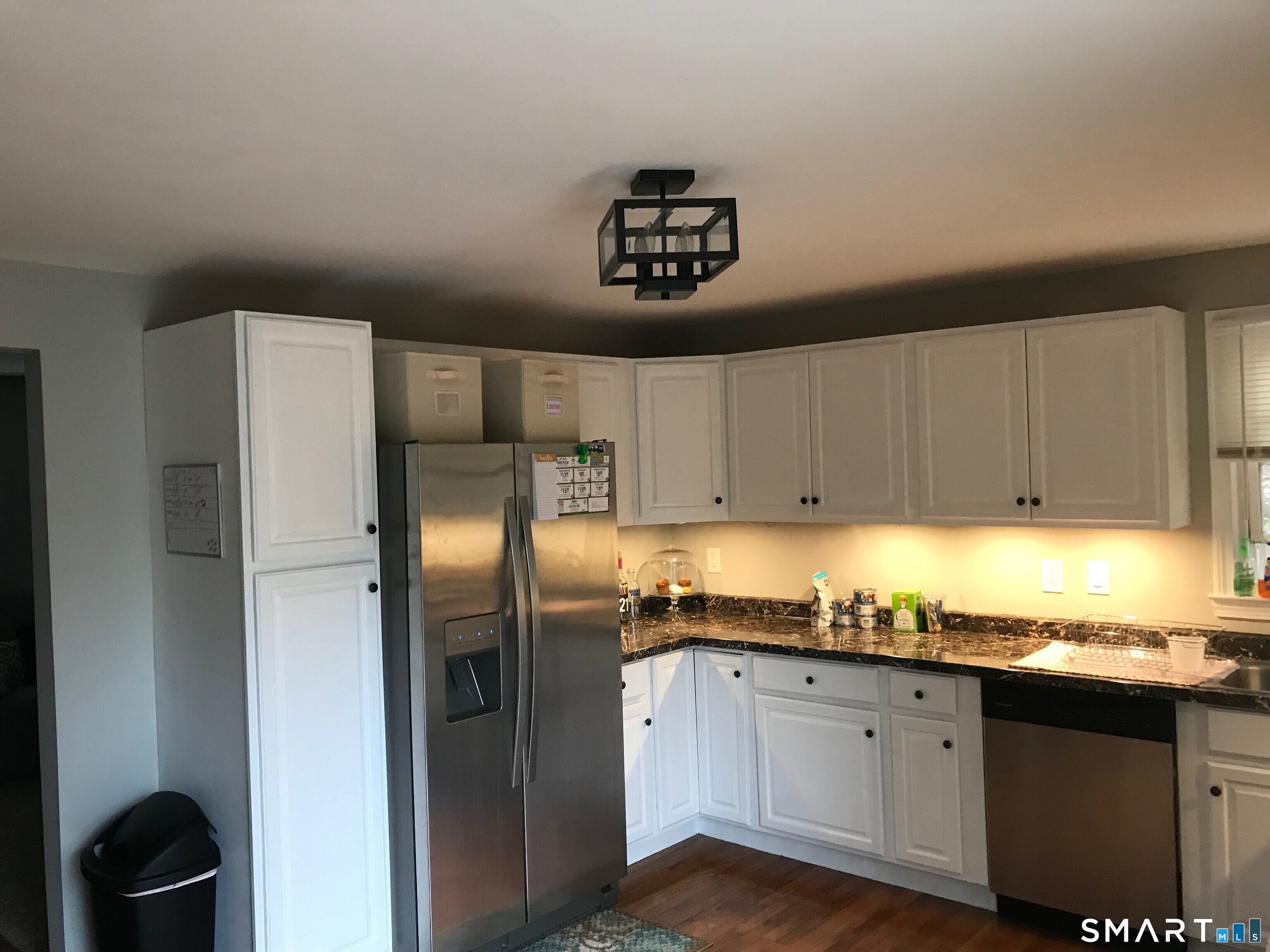 224 Anns Farm Road Hamden, CT 06518 - Photo 3 of 17 a kitchen with granite countertop a refrigerator and a sink