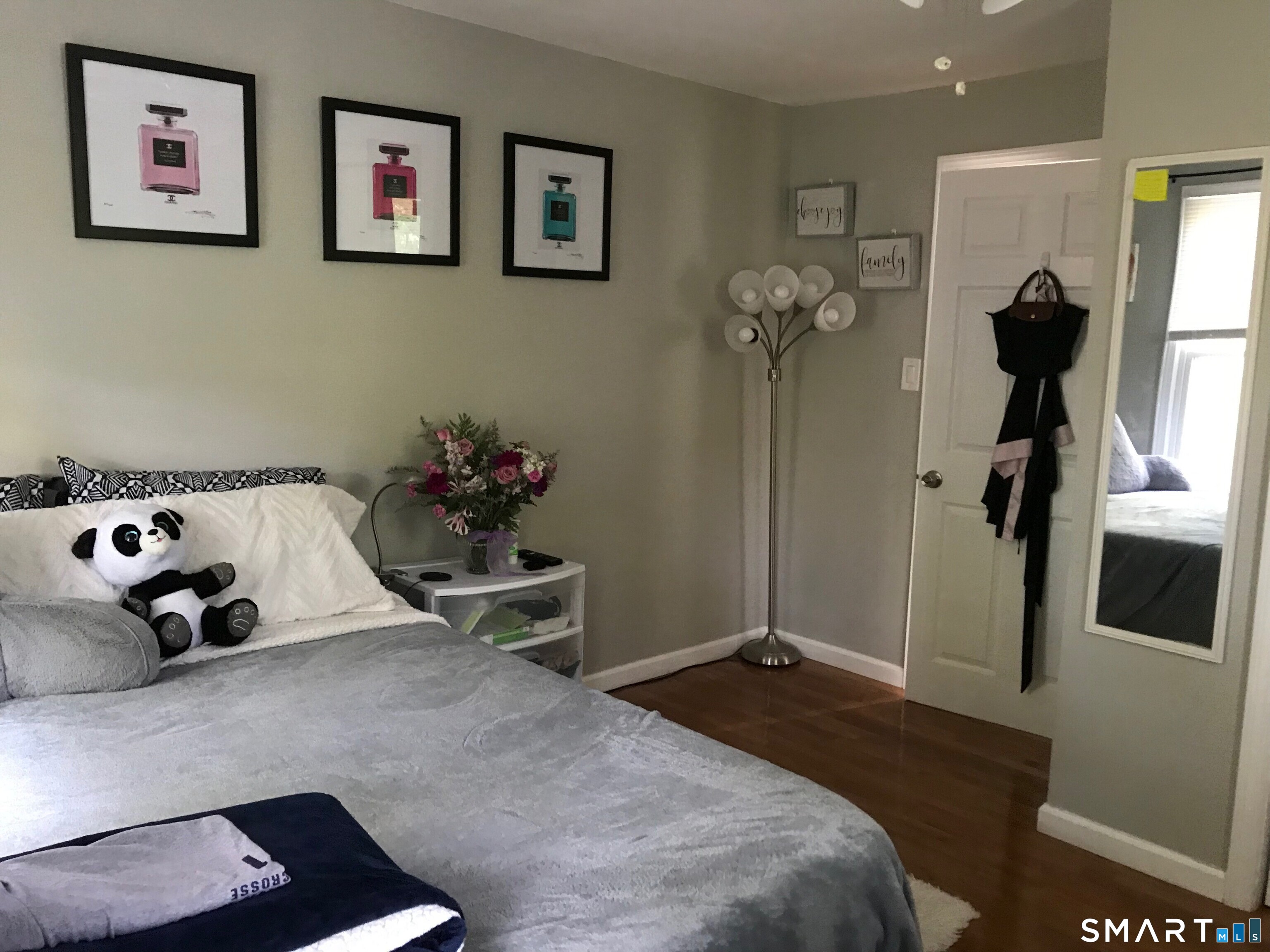 224 Anns Farm Road Hamden, CT 06518 - Photo 5 of 17 a bedroom with a bed and a potted plant