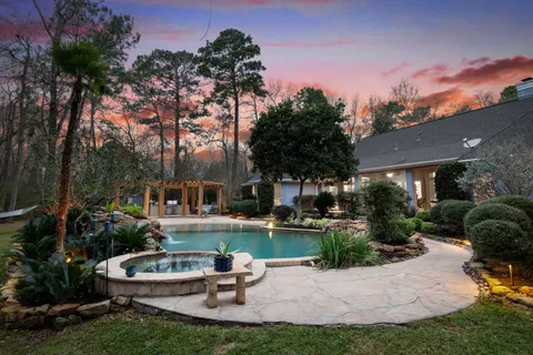 a front view of house with yard outdoor seating and green space