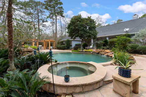 a view of a swimming pool with outdoor seating