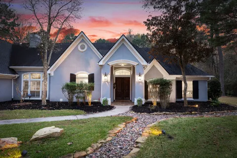 a view of a livingroom with furniture and a window