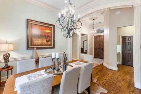 a kitchen with stainless steel appliances granite countertop a stove and a white cabinets