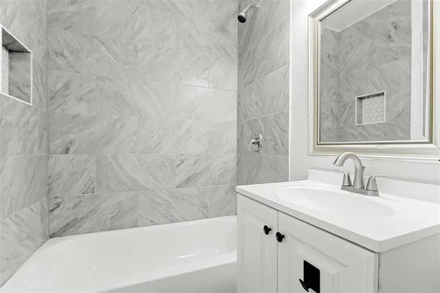 a bathroom with a sink and a bathtub