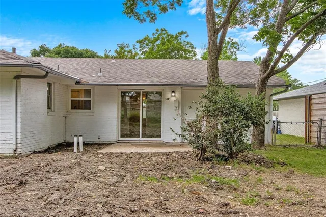 a house with a tree in the background