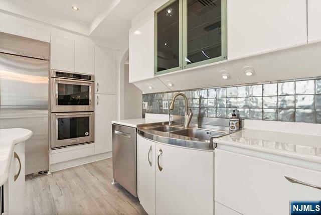 100 Carlyle Drive, Unit PHDN Cliffside Park, NJ 07010 - Photo 13 of 39 a kitchen with stainless steel appliances granite countertop a sink and a stove