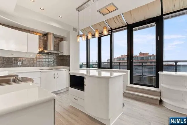 a bedroom with a large bed and a flat screen tv