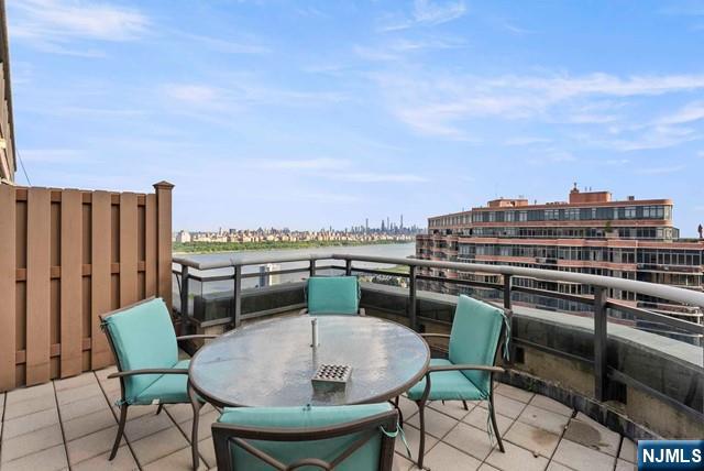 100 Carlyle Drive, Unit PHDN Cliffside Park, NJ 07010 - Photo 20 of 39 a balcony with a table and chairs