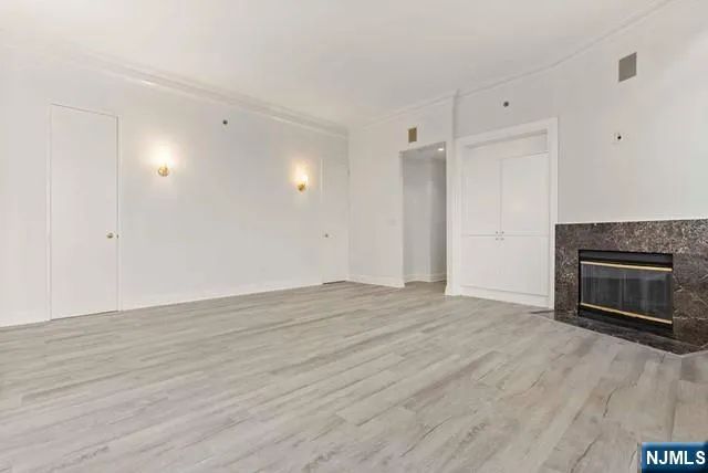 a view of a room with an entryway and a window