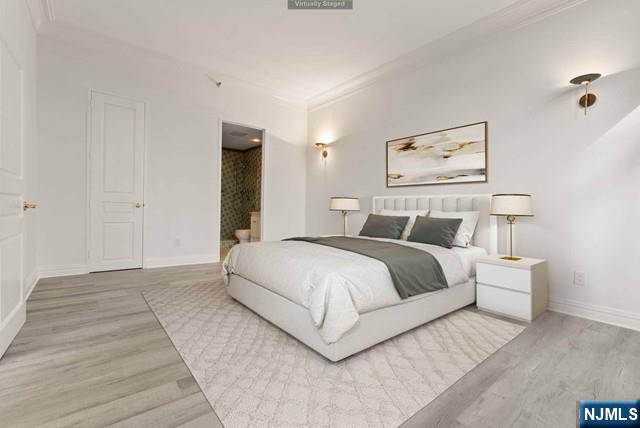 100 Carlyle Drive, Unit PHDN Cliffside Park, NJ 07010 - Photo 28 of 39 a bedroom with a bed and painting on the wall