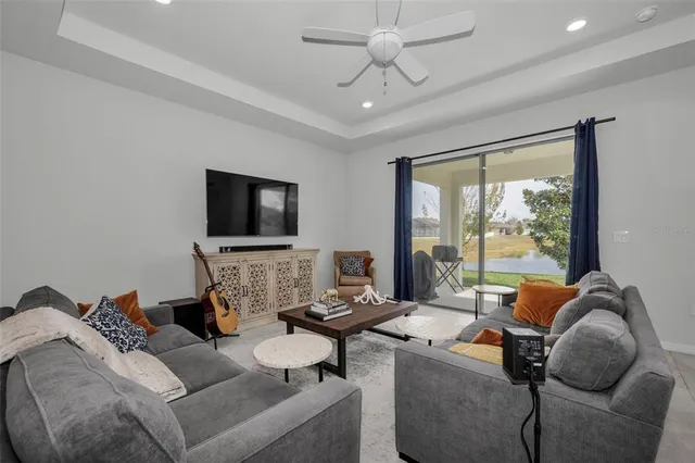 a kitchen with kitchen island granite countertop a sink a counter space stainless steel appliances and cabinets