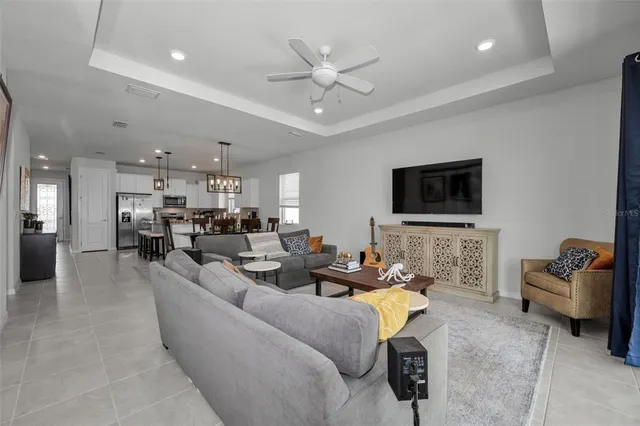 a kitchen with sink a microwave a stove and cabinets