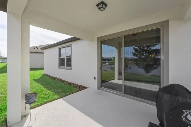 a view of a swimming pool with outdoor seating