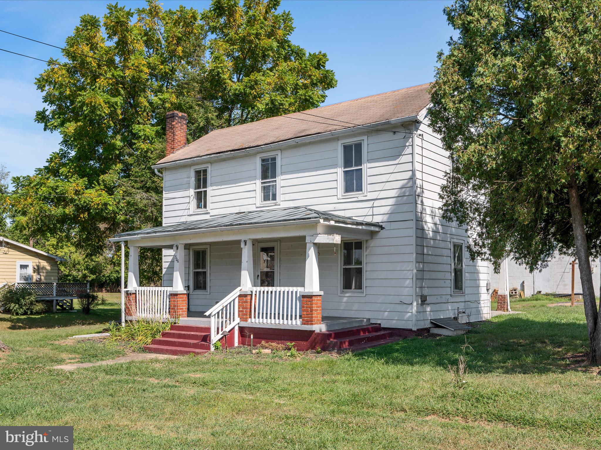 306 West 6th Avenue Ranson, WV 25438 - Photo 3 of 46 a view of a house with a yard porch and sitting area