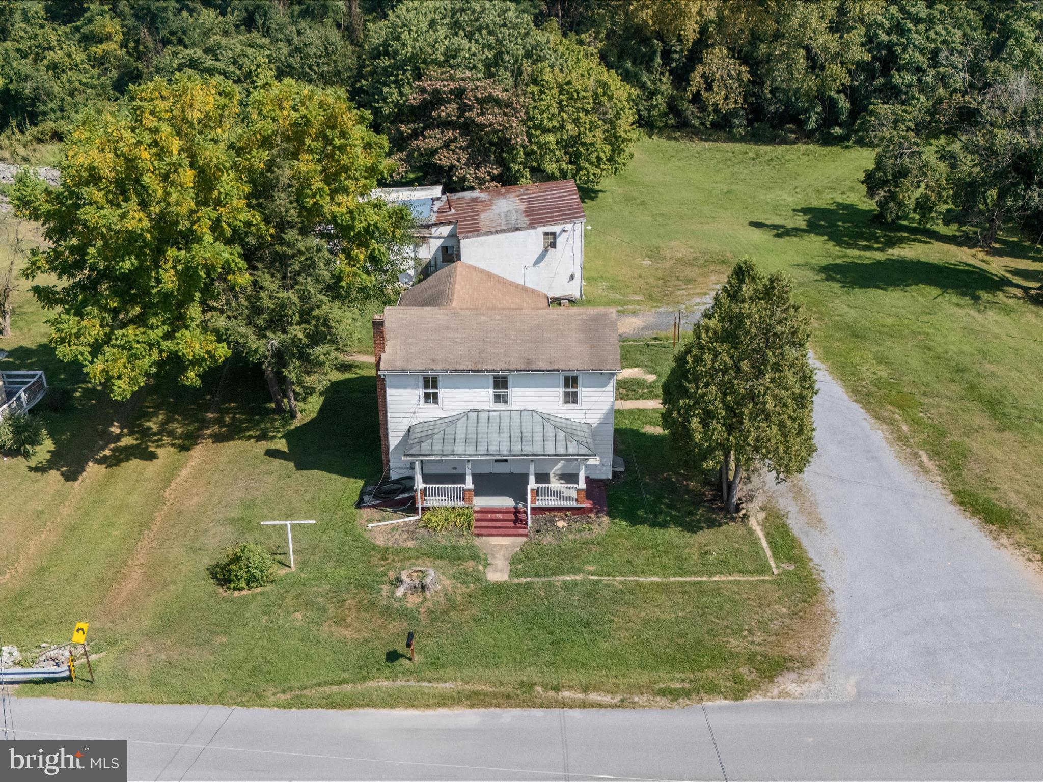 306 West 6th Avenue Ranson, WV 25438 - Photo 41 of 46 an aerial view of a house with a yard basket ball court and outdoor seating