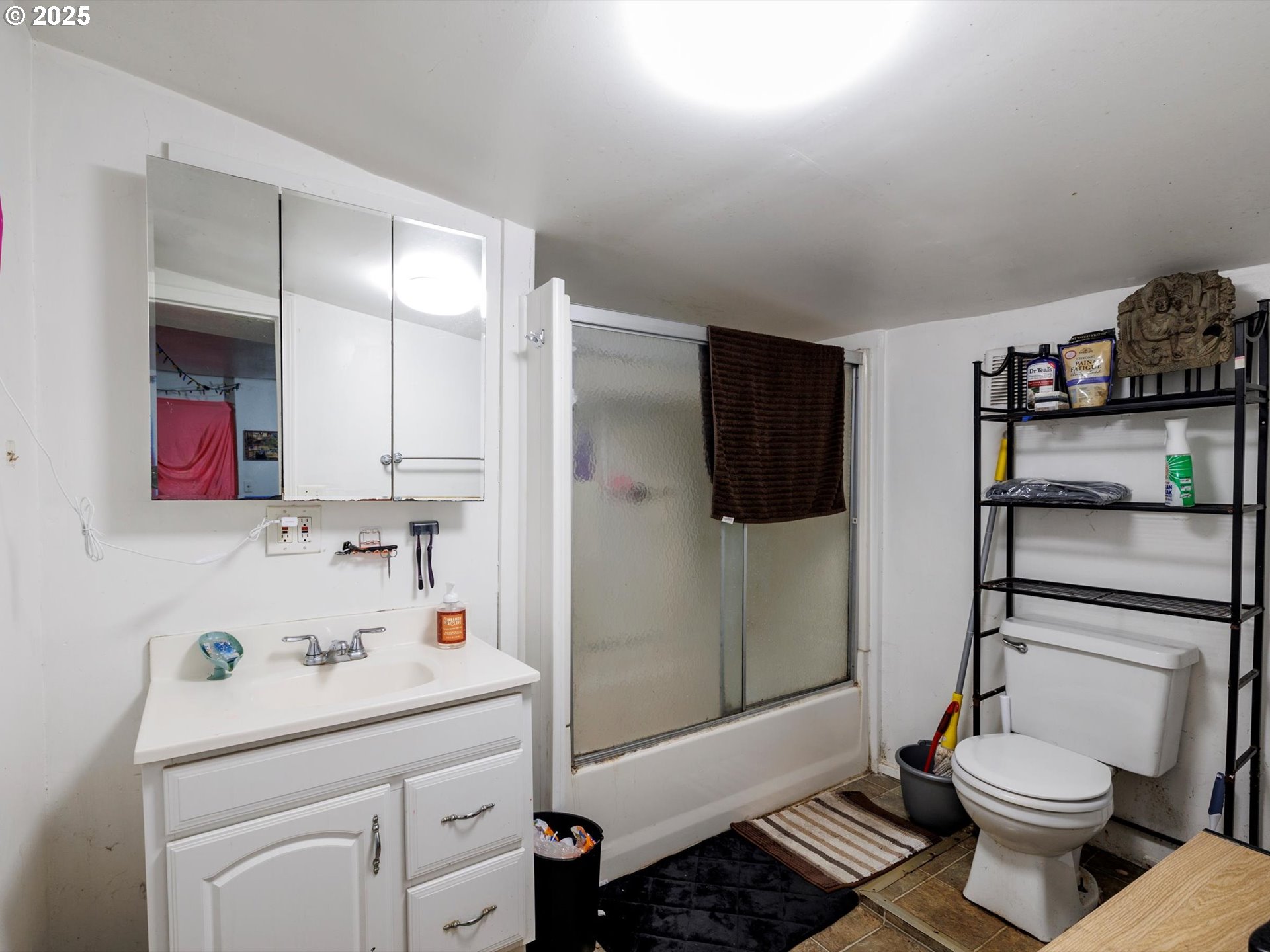 4840 Northeast 99th Avenue Portland, OR 97220 - Photo 11 of 15 a bathroom with a sink toilet and shower