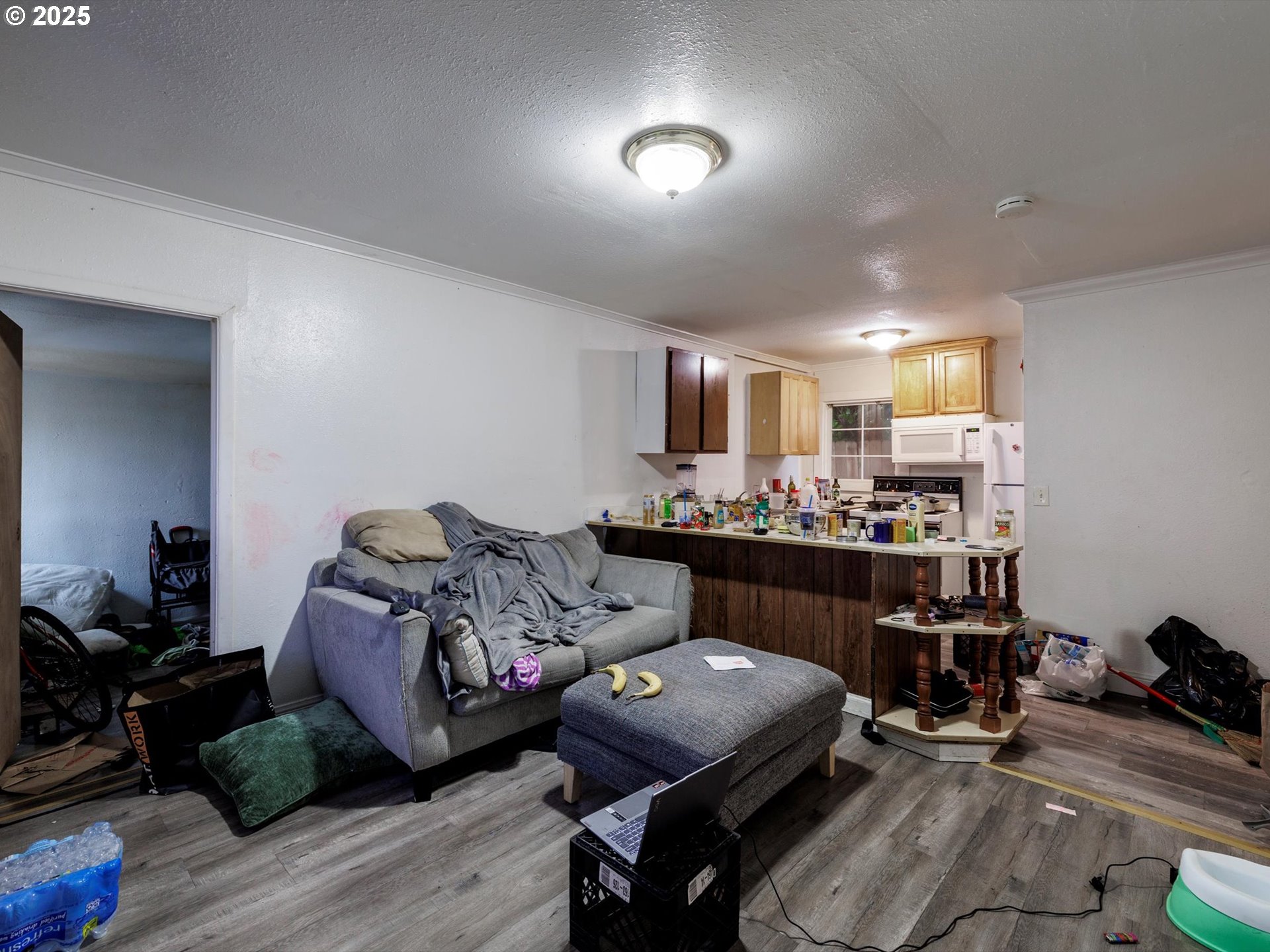 4840 Northeast 99th Avenue Portland, OR 97220 - Photo 13 of 15 a bedroom with furniture and a wooden floor