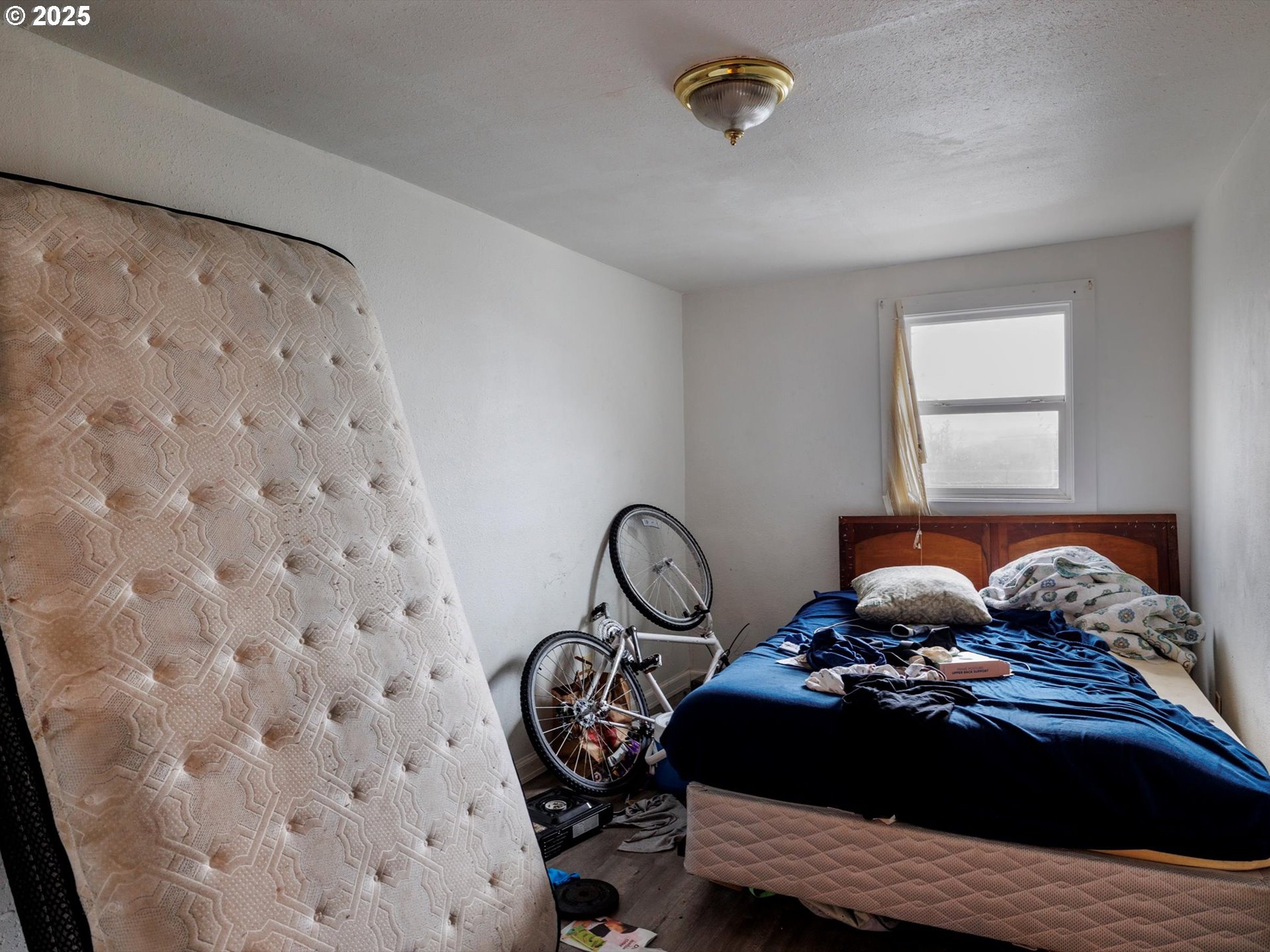 4840 Northeast 99th Avenue Portland, OR 97220 - Photo 14 of 15 a bedroom with a bed and a window