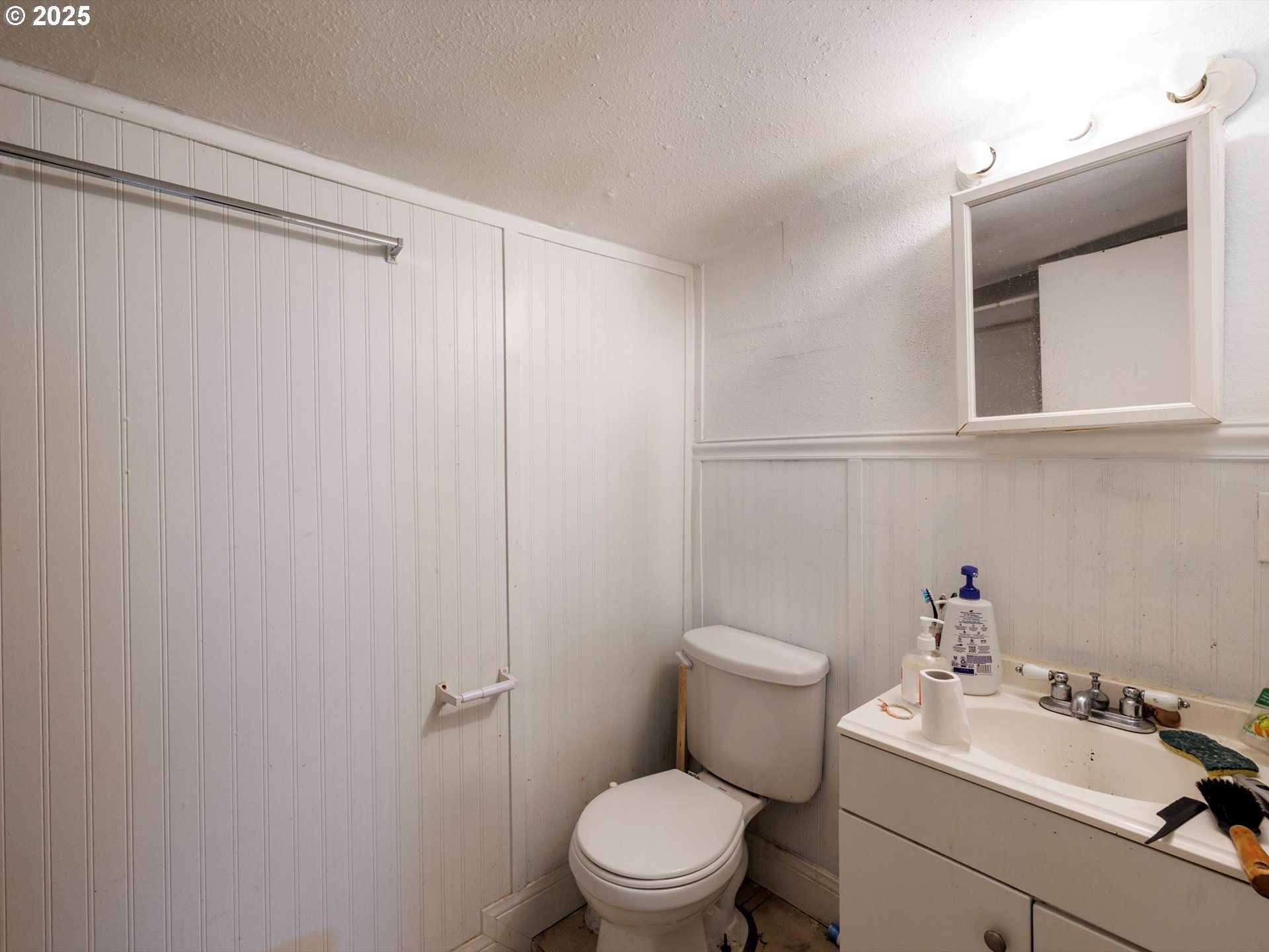 4840 Northeast 99th Avenue Portland, OR 97220 - Photo 15 of 15 a bathroom with a sink mirror and toilet