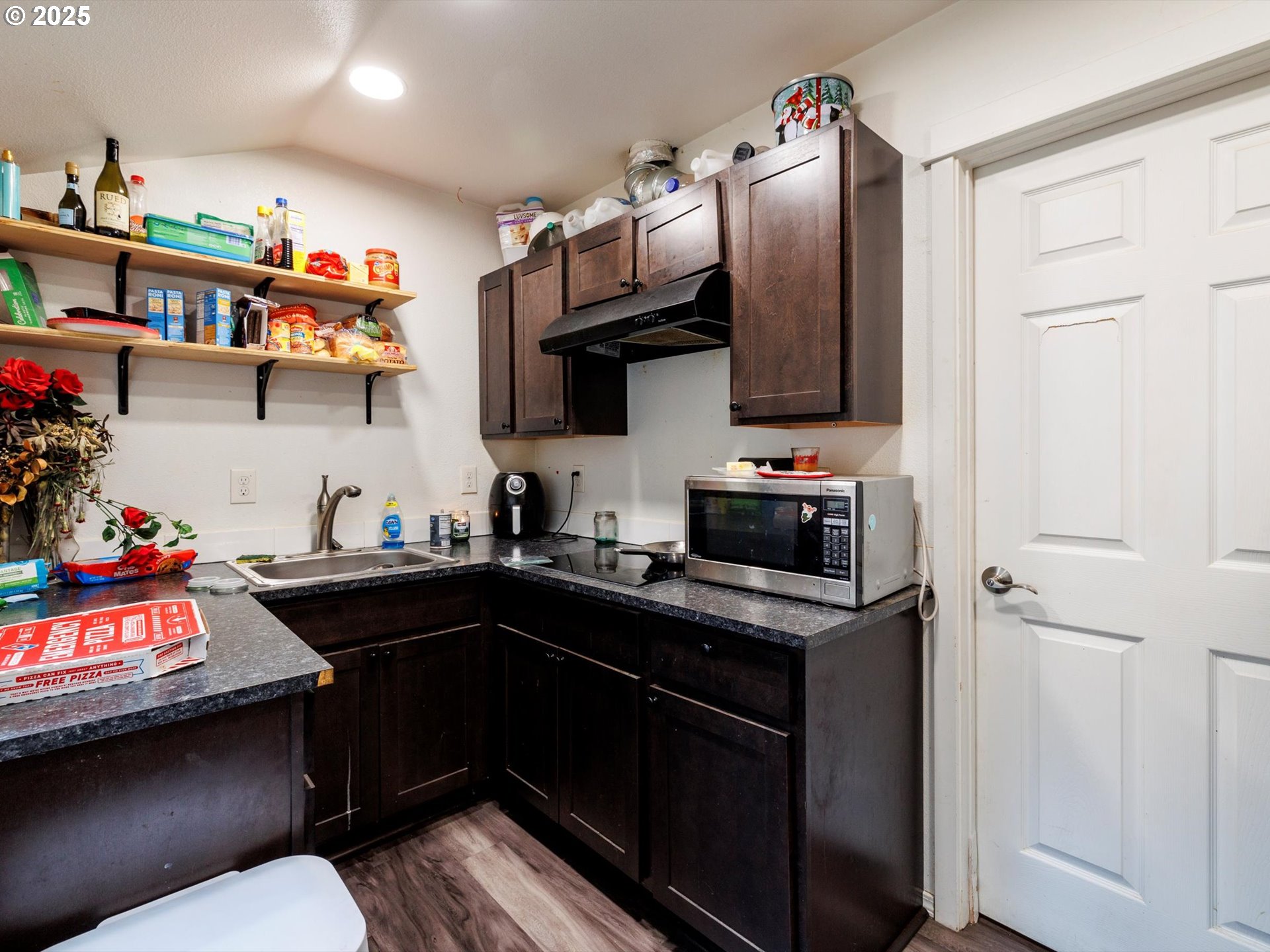 4840 Northeast 99th Avenue Portland, OR 97220 - Photo 6 of 15 a kitchen with stainless steel appliances granite countertop a sink stove and cabinets