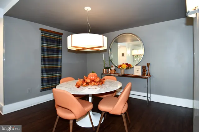 a large white kitchen with stainless steel appliances