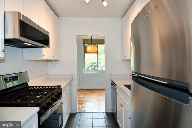 a kitchen with a stove and a microwave