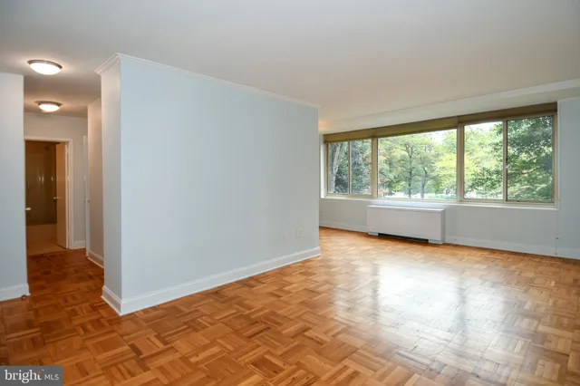 a view of an empty room with a window