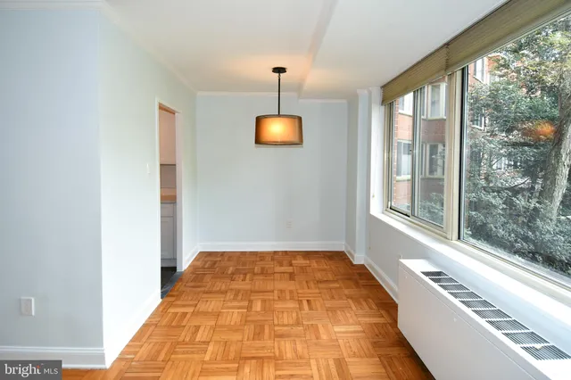 a bathroom with a sink a light fixture and a mirror