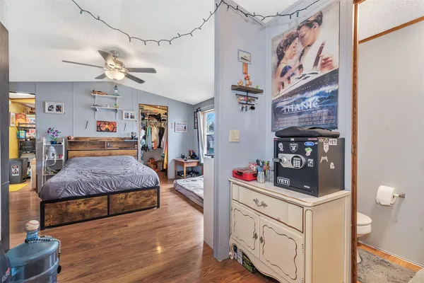 a bedroom with a bed and cabinets