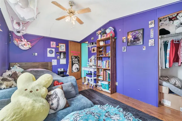 a bedroom with bed and a window