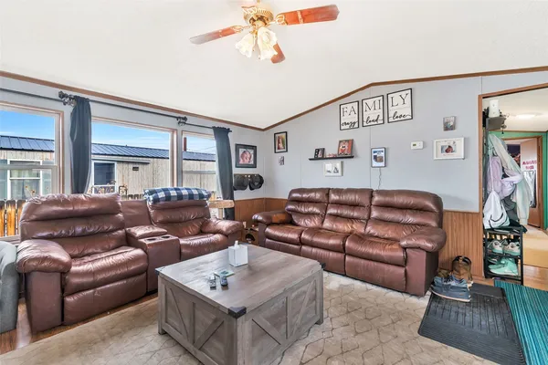 a living room with furniture and a window
