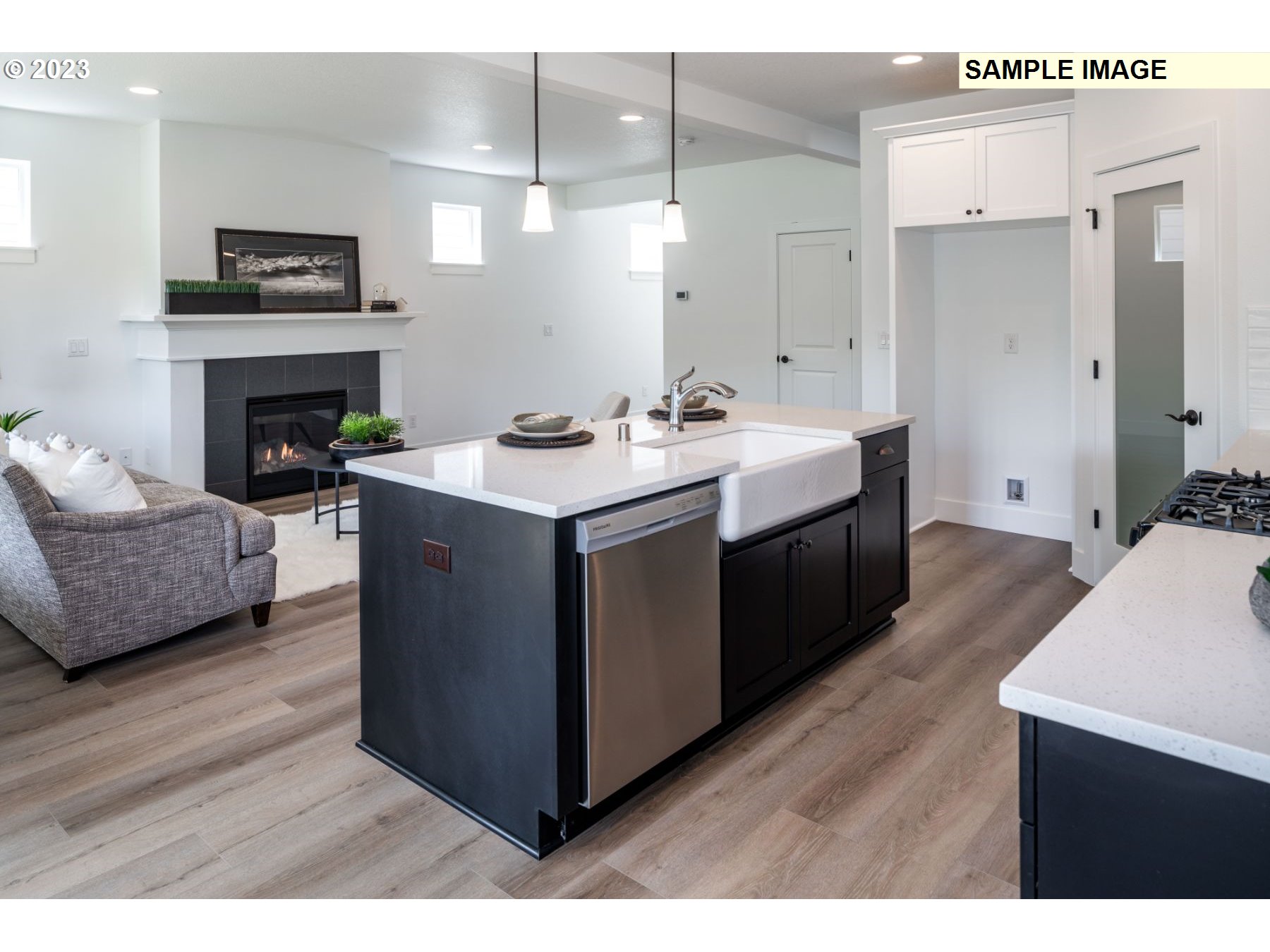 718 Northwest 178th Street Ridgefield, WA 98642 - Photo 29 of 37 a kitchen with a sink cabinets and wooden floor