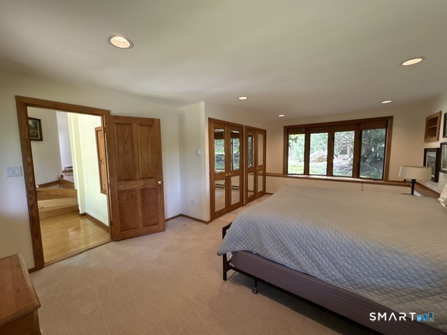 40 Looking Glass Hill Road Litchfield, CT 06750 - Photo 28 of 33 a spacious bedroom with a large bed and a large window