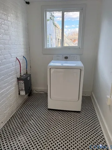 a bathroom with a sink a mirror and window