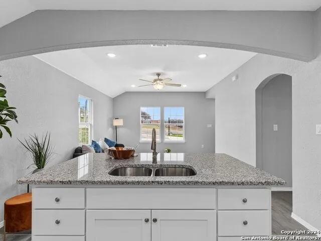 a bathroom with a double vanity sink and a mirror